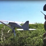This handout photo taken from video released by Russian Defense Ministry Press Service on Monday, Aug. 8, 2022, shows a Russian serviceman preparing a Orlan-10 reconnaissance drone to launch at an undisclosed location. (Russian Defense Ministry Press Service photo via AP)