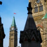 The Canadian flag flies atop the Peace Tower on Parliament Hill in Ottawa on Oct. 30, 2024. 