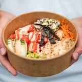 Researchers tested paper takeout food packaging and found that items such as compostable bowls contained PFAS or 'forever chemicals.' (Ben Nelms/CBC)