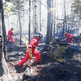 Three Halifax Regional Fire and Emergency firefighters work to put out fires in the Tantallon, N.S., area. (Communications Nova Scotia)