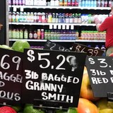 Apples, potatoes and other items are displayed at a grocery store in Aventura, Fla., in June 2018. Amid high inflation, commentators on both sides of the border have been pushing for a return to prices seen before the pandemic. (Brynn Anderson/The Associated Press)