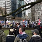 A group of pro-Israel protesters have set up outside the Roddick Gates at the entrance of McGill University's downtown Montreal campus, steps away from the pro-Palestinian encampment that has been in place for six days. Montreal police officers are standing between both groups.