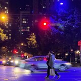 In Vancouver, more than 100 blue or purple street lights have been reported to the city — the result of a manufacturing defect involving a coating on the light. The downtown intersection of Davie and Richards Streets shows the contrast between the indigo lights, and the traditional orange street light. (Susana Da Silva/CBC)