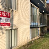 A rental sign is posted outside a Calgary apartment building in July 2022. (Paula Duhatschek/CBC)