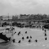 The view looking east along 'Nan White' Beach, showing personnel of the 9th Canadian Infantry Brigade landing on D-Day.
