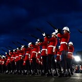 A guard of honour performs a 'feu de joie' during a sunset ceremony to celebrate the Class of 2024 at the Royal Military College (RMC) in Kingston, Ont., on May 16. 