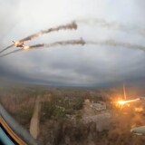 In this photo taken from video released by the Russian Defence Ministry Press Service on Monday, Jan. 22, 2024, a Su-25 warplane is seen from the cockpit of another such aircraft as they fire rockets on a mission over Ukraine. (Russian Defense Ministry Press Service via Associated Press)
