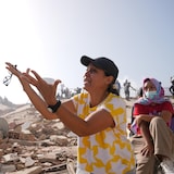 Two days after the earthquake, people search for missing loved ones at the site of the collapsed apartment building where they had lived, in La Guaira, Venezuela.