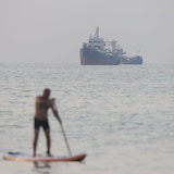 Throughout much of the Israel-U.S. war against Iran, the Iranians have blocked the Strait of Hormuz, seen Sunday near the beach of Bandar Abbas, and charged tolls for ships to pass. Some worry other countries will do the same with other chokepoints around the world.
