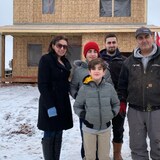 The Toma family is shown in front of their new home. From left, in the back, are Basma, Thomas, Odiss and Joseph. Peter is in front. Andre, one of four sons, is missing from the photo. 