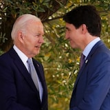 Prime Minister Justin Trudeau talks with U.S. President Joe Biden as they take part in a family photo at the G7 Summit in Savelletri Di Fasano, Italy on Thursday, June 13, 2024.