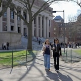 Students walk on the campus of Harvard University in Cambridge, Mass., in April 2025. The Trump administration dealt a major blow Thursday by announcing it was revoking Harvard University's ability to enrol international students. 