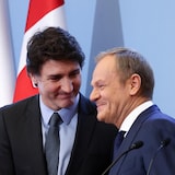 Prime Minister Justin Trudeau and Polish Prime Minister Donald Tusk, right, address the media following their talk on European security in Warsaw, Poland, on Monday. 