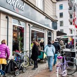 People walk past a Wefood supermarket in Copenhagen in 2016. The supermarket sells deeply discounted food items that are damaged or near expiry. (Soeren Bidstrup/AFP via Getty Images)