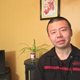 Xianqi Cheng is trying hard to learn French, but a surprise French oral examination mandated by the Quebec government has him worried he will be forced to leave the province. (Elias Abboud/CBC)