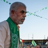 Yahya Sinwar, the Palestinian leader of Hamas in the Gaza Strip, takes the stage at a Gaza rally in May 2021. Sinwar, 61, is considered to be one of the masterminds behind Hamas's Oct. 7 attacks that killed 1,200 Israelis, and has been marked as a 'dead man walking' by Israel. (John Minchillo/The Associated Press)