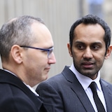 Umar Zameer thanks defence lawyer Nader Hasan while speaking to reporters outside the courthouse following his not guilty verdict, in Toronto on Sunday. 