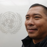 Mukha ni Morses Caoagas Flores habang may logo ng United Nations sa kanyang background.
