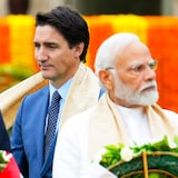 Prime Minister Justin Trudeau, left, walks past Indian Prime Minister Narendra Modi as they take part in a wreath-laying ceremony at Raj Ghat, Mahatma Gandhi's cremation site, during the G20 Summit in New Delhi on Sunday, Sept. 10, 2023. (Sean Kilpatrick/The Associated Press)