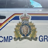 Close-up of the RCMP logo on a vehicle. Photo taken in Calgary, Alberta on June 28, 2022.