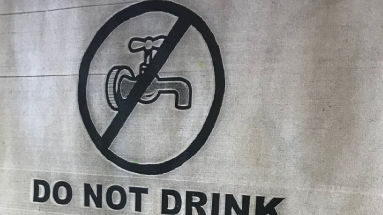 Une affiche montrant un robinet barré.