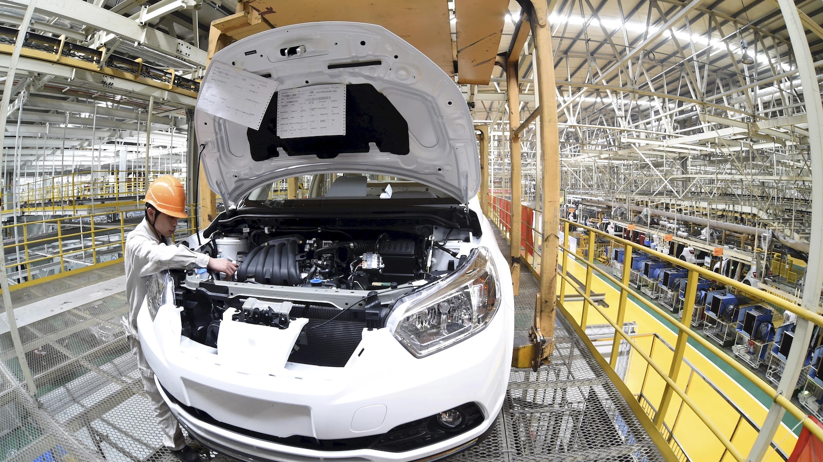 Une chaîne de production dans une usine de Dongfeng Nissan Passenger Vehicle Co. à Zhengzhou, province du Henan, en Chine.