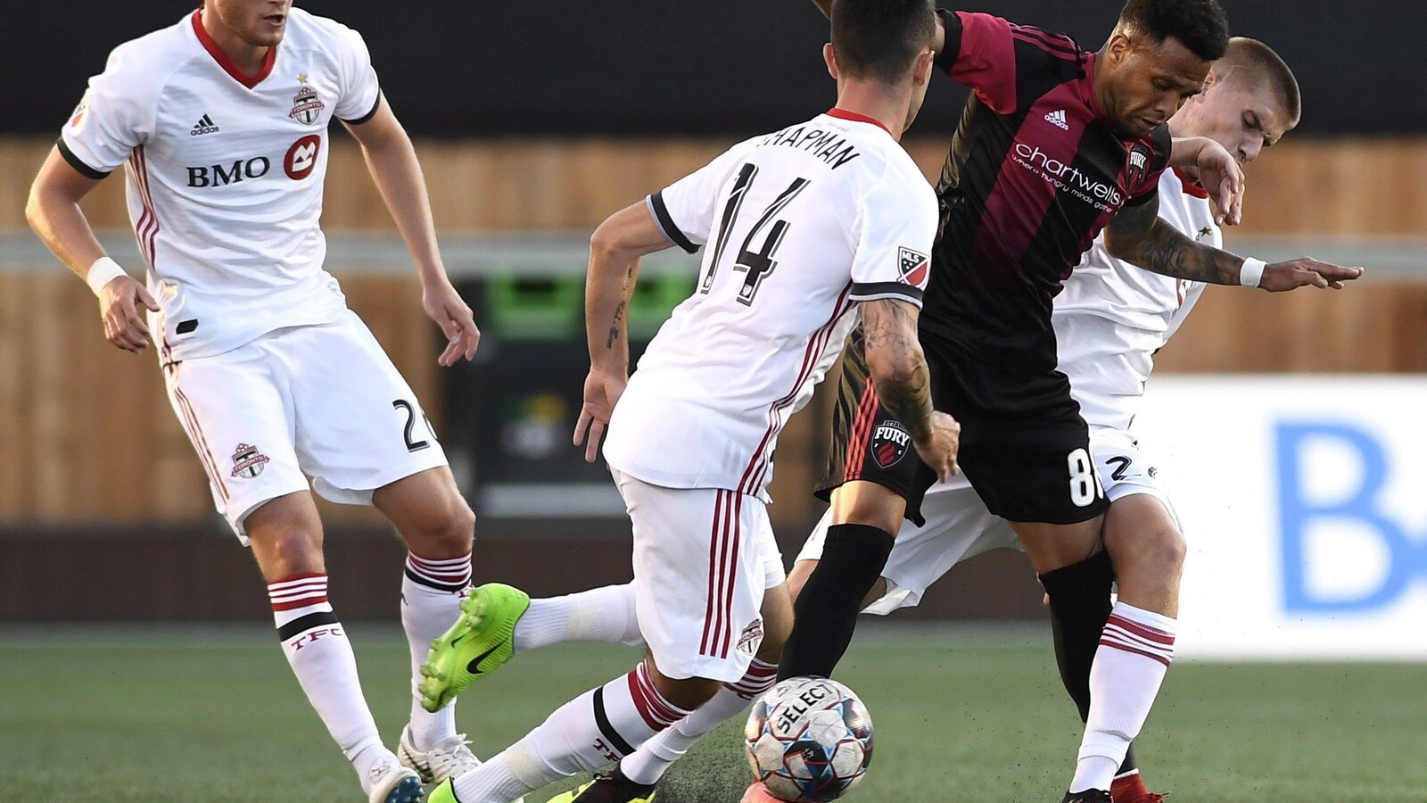 Ottawa Fury FC's Kevin Oliveira (88) tries to keep the ball from Toronto FC's Jay Chapman (14) and Liam Fraser (27) during first half Canadian Championship soccer action in Ottawa on Wednesday, July 18, 2018. THE CANADIAN PRESS/Justin Tang