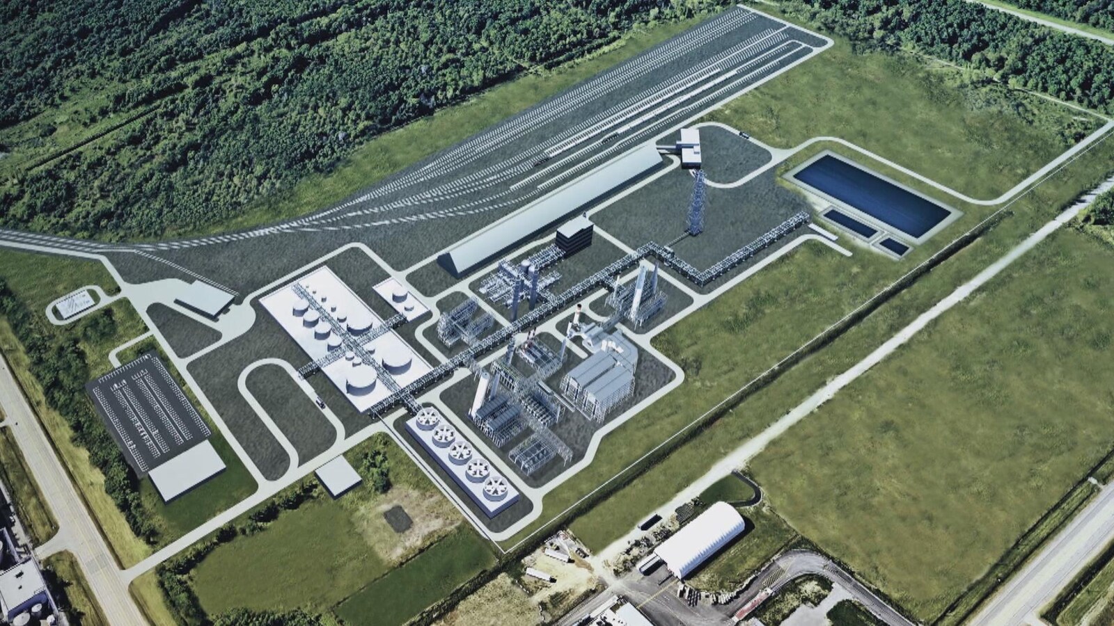 Image d'une vue aérienne du projet où on voit des bâtiments et des arbres