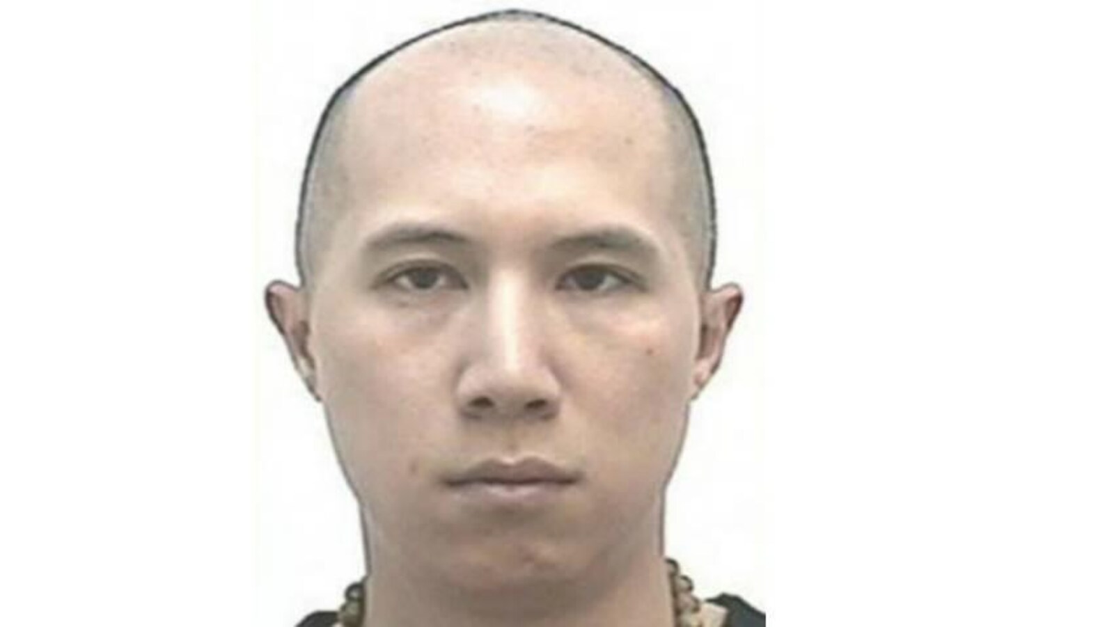 Photo de Nick Chan sans aucune expression.