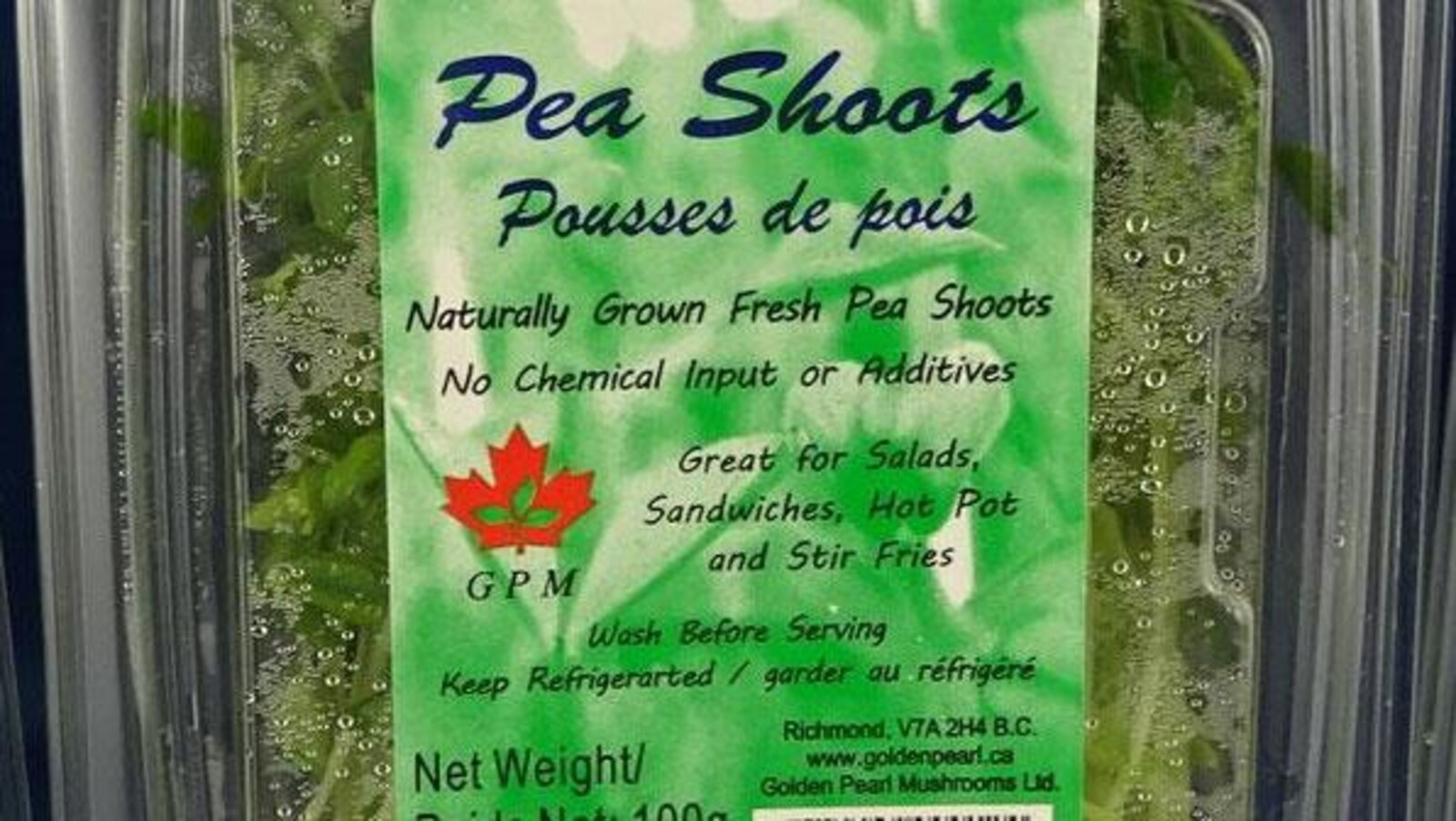 Un contenant de pousses de pois de marque Golden Pearl Mushroom.