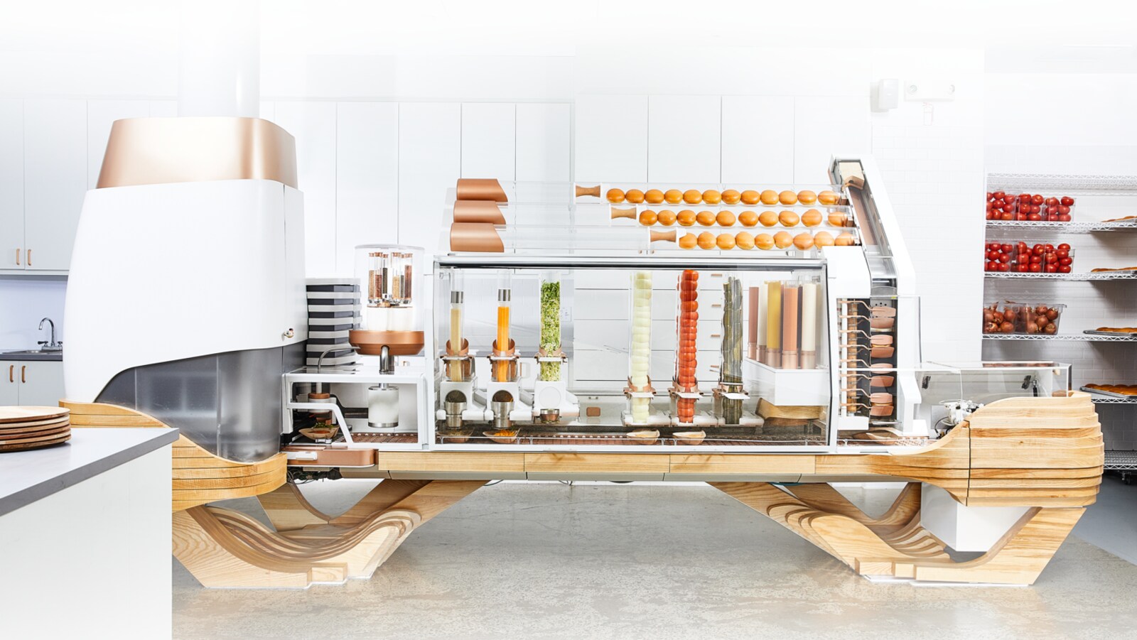 Une photo montrant le robot de Creator, avec ses tubes d'ingrédients à hamburger.