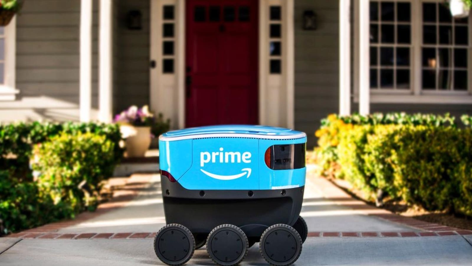 Un robot à six roues avec le logo en sourire Amazon.
