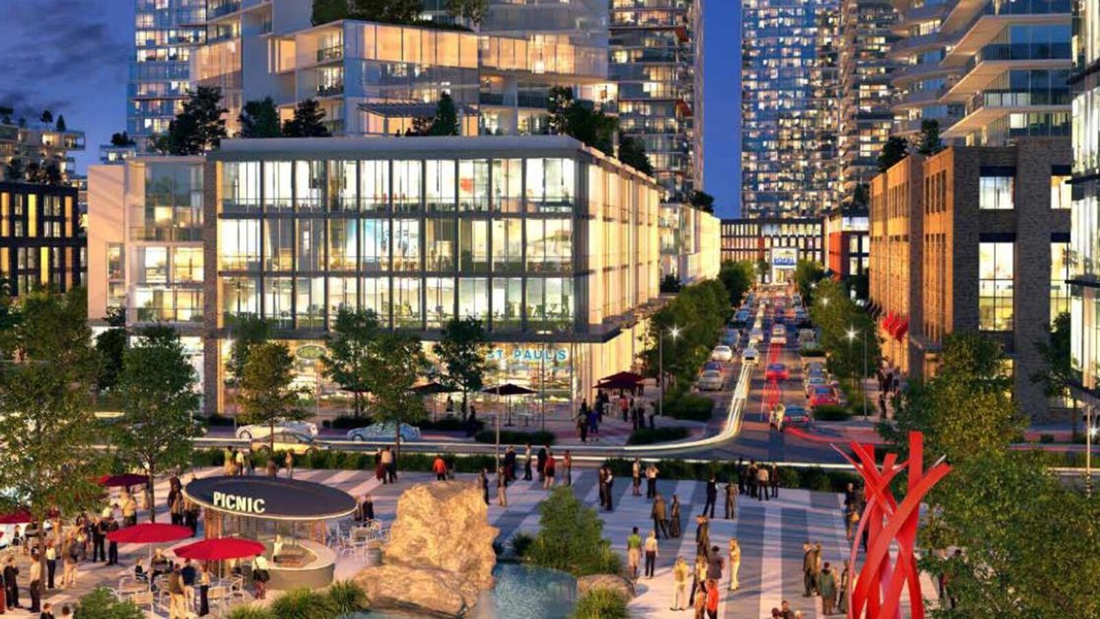 Il s'agit d'une image modélisée du futur village urbain. Des tours d'habitations illuminées sont construites de part et d'autre d'un boulevard. Au premier plan se trouve une place avec une fontaine, des tables, des chaises et des parasols.