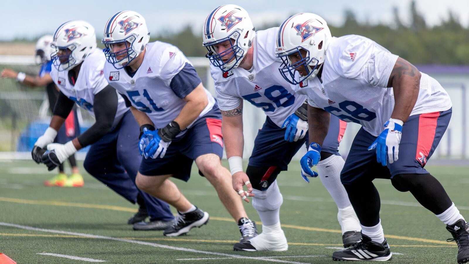 De gauche à droite, on retrouve les joueurs de ligne offensive Brian Simmons, Kristian Matte, Luc Brodeur-Jourdain et Philip Blake.