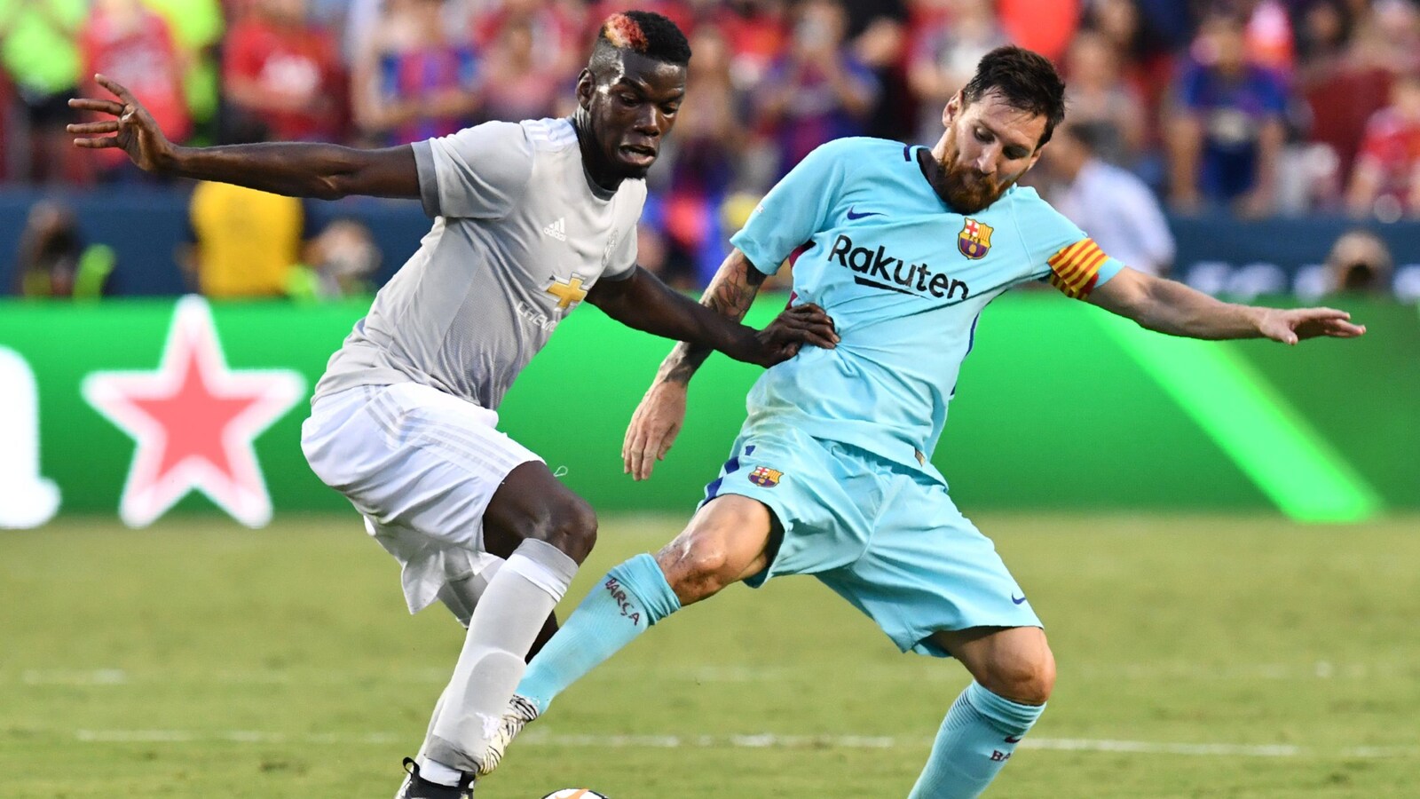 Paul Pogba (gauche) et Lionel Messi (droite)