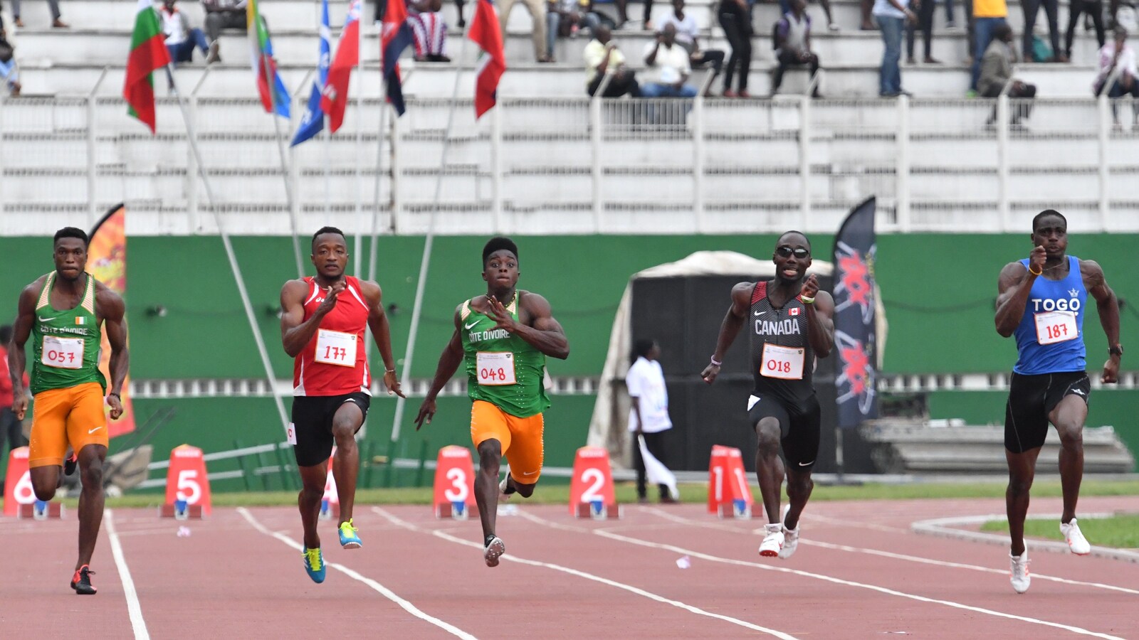 La finale du 100 m aux Jeux de la francophonie d'Abidjan, remportée par Dylan Sicobo des Seychelles. Le Canadien Bismark Boateng (no 18) a gagné le bronze.