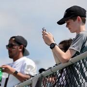 ORLANDO, FL - APRIL 16:  Fans use their phones to take photos of QR codes during the UCF Spring Game at the Bounce House on April 16, 2022 in Orlando, Florida. The players are wearing QR codes on their jerseys instead of traditional numbers which will send viewers to the players' backgrounds online, merchandise stores, social media accounts and charities of choice. (Photo by Alex Menendez/Getty Images)