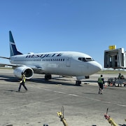 Un avion de WestJet à l'aéroport international John G. Diefenbaker de Saskatoon, en Saskatchewan, le 18 mai 2023.