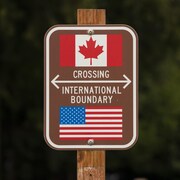 Un panneau marque la frontière entre les États-Unis et le Canada.