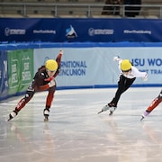 DRESDEN, GERMANY - JANUARY 28: Florence Brunelle of Canada , Ann-Sophie Bachand of Canada , Jiarui Song of China and Myeongbi Jung of Germany perform in Women`s 500m Final A race during the ISU World Junior Short Track Speed Skating Championships at  on January 28, 2023 in Dresden, Germany. (Photo by Christian Kaspar-Bartke - International Skating Union/International Skating Union via Getty Images)
