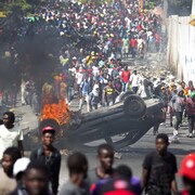 Des manifestants à Port-au-Prince réclament la démission du président Jovenel Moïse.