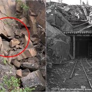À gauche, des roches amoncelées. À droite, l'entrée d'une mine avec des rails. 