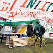 Pro-Palestinian activists enter an encampment set up on McGill University's campus in Montreal, Monday, April 29, 2024.
