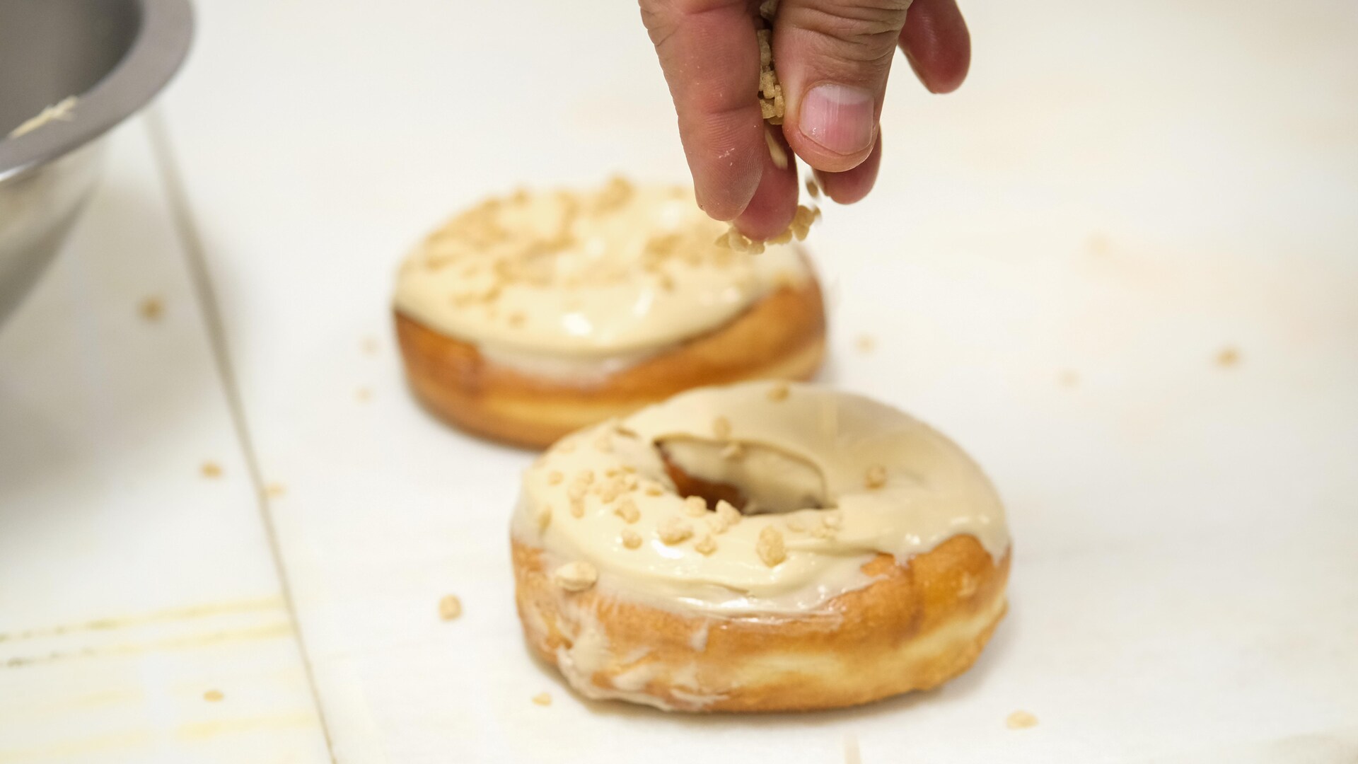 Two donuts glazed on a table. Two donuts glazed on a table.