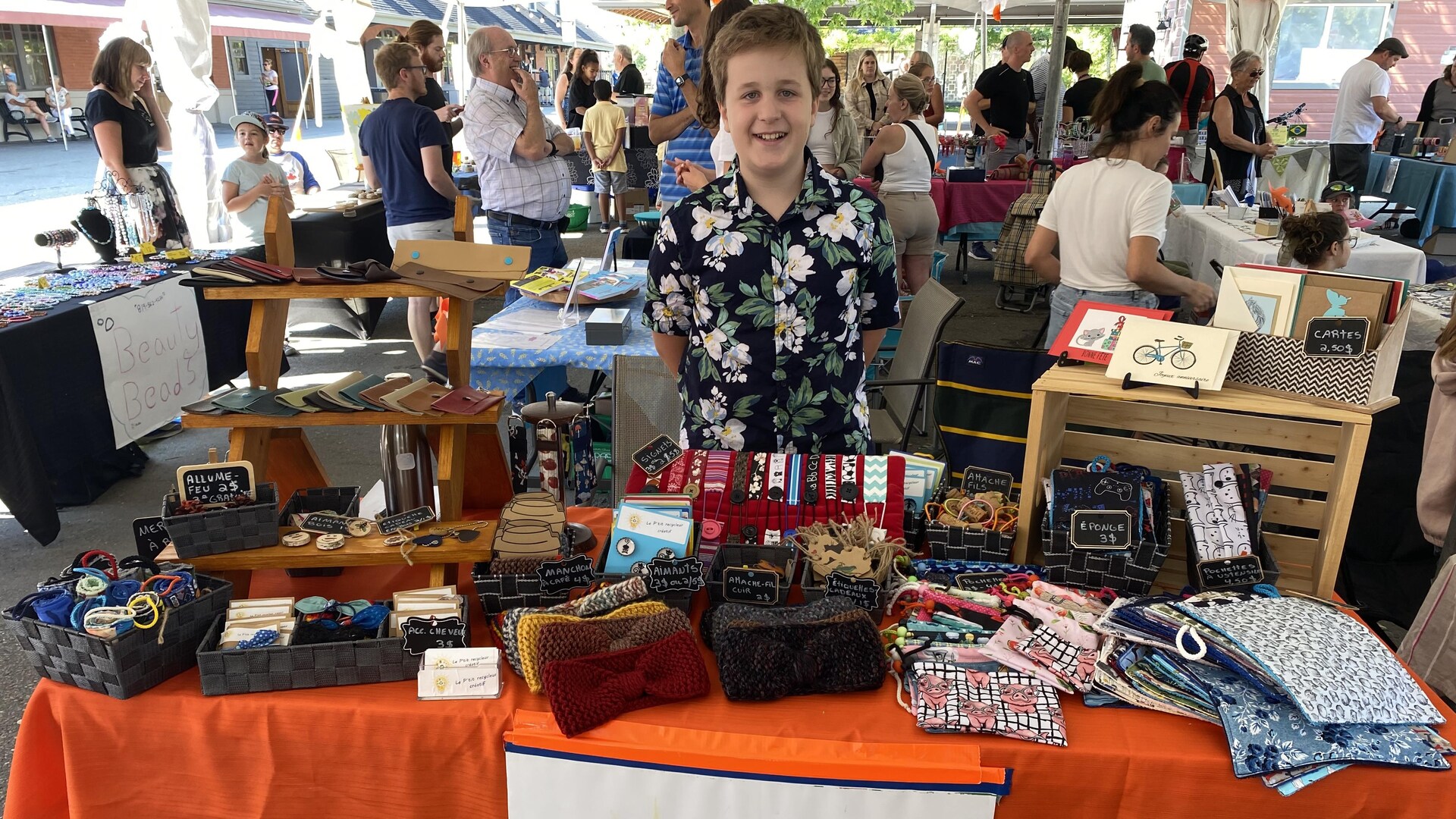 Justin Fournier, the little creative recycler, exhibits his headbands, purses and magnets. Justin Fournier, the little creative recycler, exhibits his headbands, purses and magnets.
