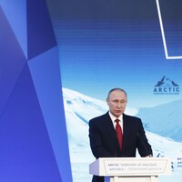 Le président Vladimir Poutine au micro lors d'une rencontre internationale.