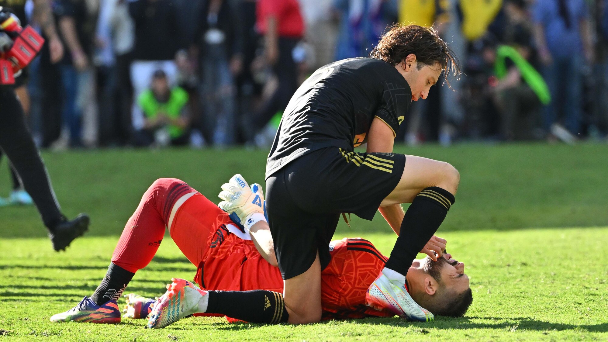 A therapist is leaning over him.