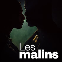 Les silhouettes d'un homme et d'une femme sur le point de s'embrasser.
