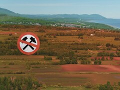 paysage agricole avec un sigle d'interdiction de mines