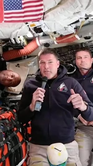 This image provided by the Canadian Space Agency, Artemis II astronaut Jeremy Hansen of Canada, connects live from the Orion spacecraft and speaks with Canadian media along with astronauts Victor Glover, left, and Reid Wiseman on Saturday, April 4, 2026.   (Canadian Space Agency via AP)